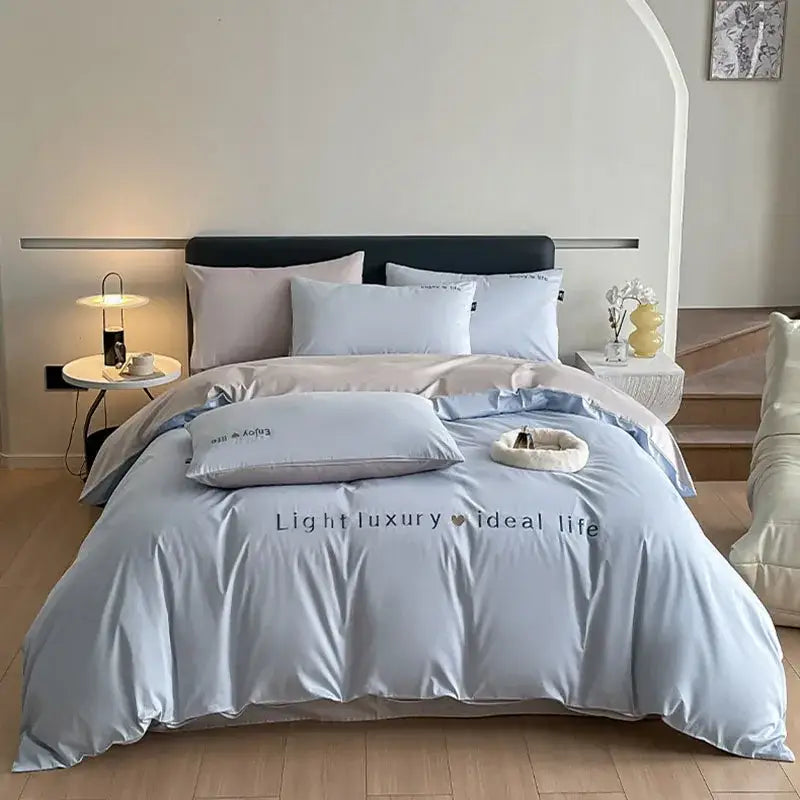 Light blue satin embroidery bedding set with subtle embroidered text ideal life for bedroom decorbites 120s long
