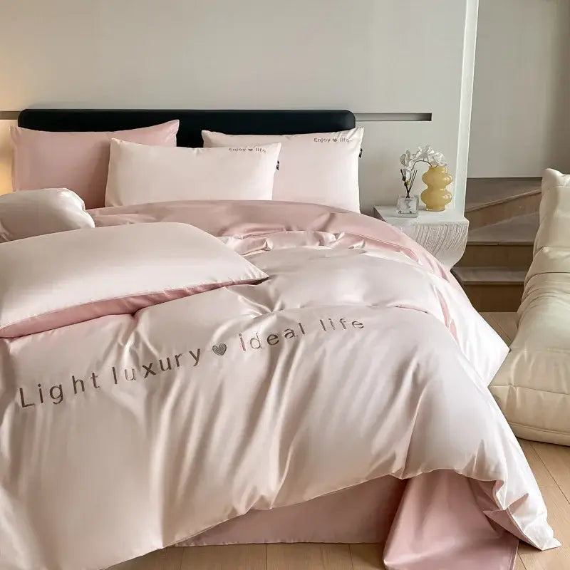 Soft blush pink satin embroidery bedding set with subtle sheen and elegant light luxury ideal life decorbites design
