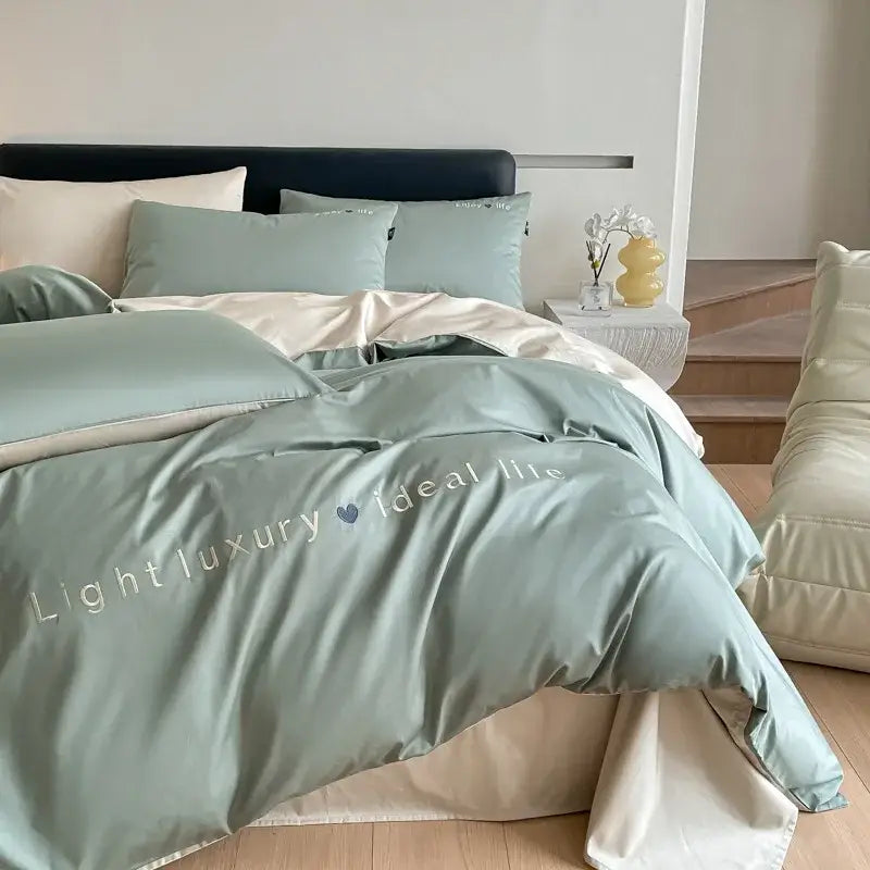 Light blue satin embroidery bedding set featuring a soft mint green duvet cover with luxury life embroidery