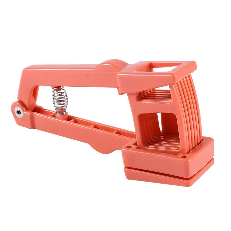 Orange plastic garlic press slicer with metal spring and handle mechanism for efficient press slicer chopper use