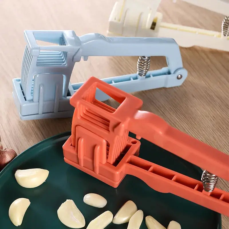 Orange plastic garlic press with spring mechanism for efficient pressing in this light blue spring loaded garlic press slicer
