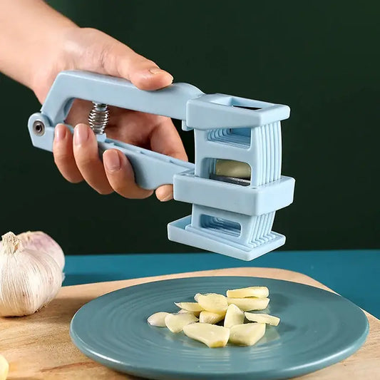 Light blue plastic garlic press slicer with spring loaded mechanism for efficient garlic pressing and chopping