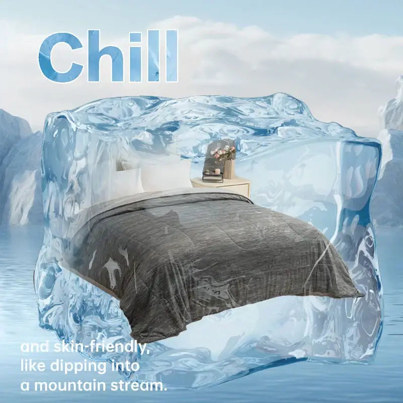 A bed with a dark gray decorbites super soft cooling blanket and white pillows encased in light blue ice