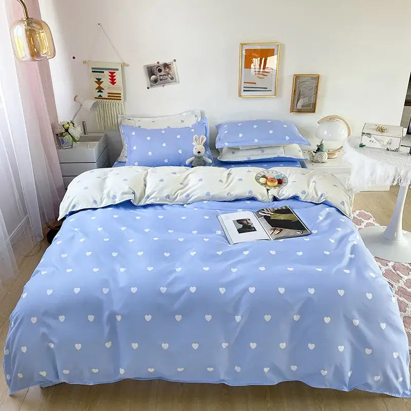 Light blue and white heart print bedding set featuring a duvet cover with a solid color heart pattern design