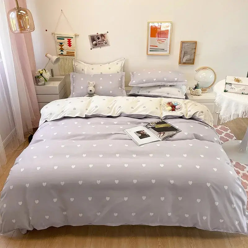 Gray solid color duvet cover with white heart print pattern in bedding set for bedroom use