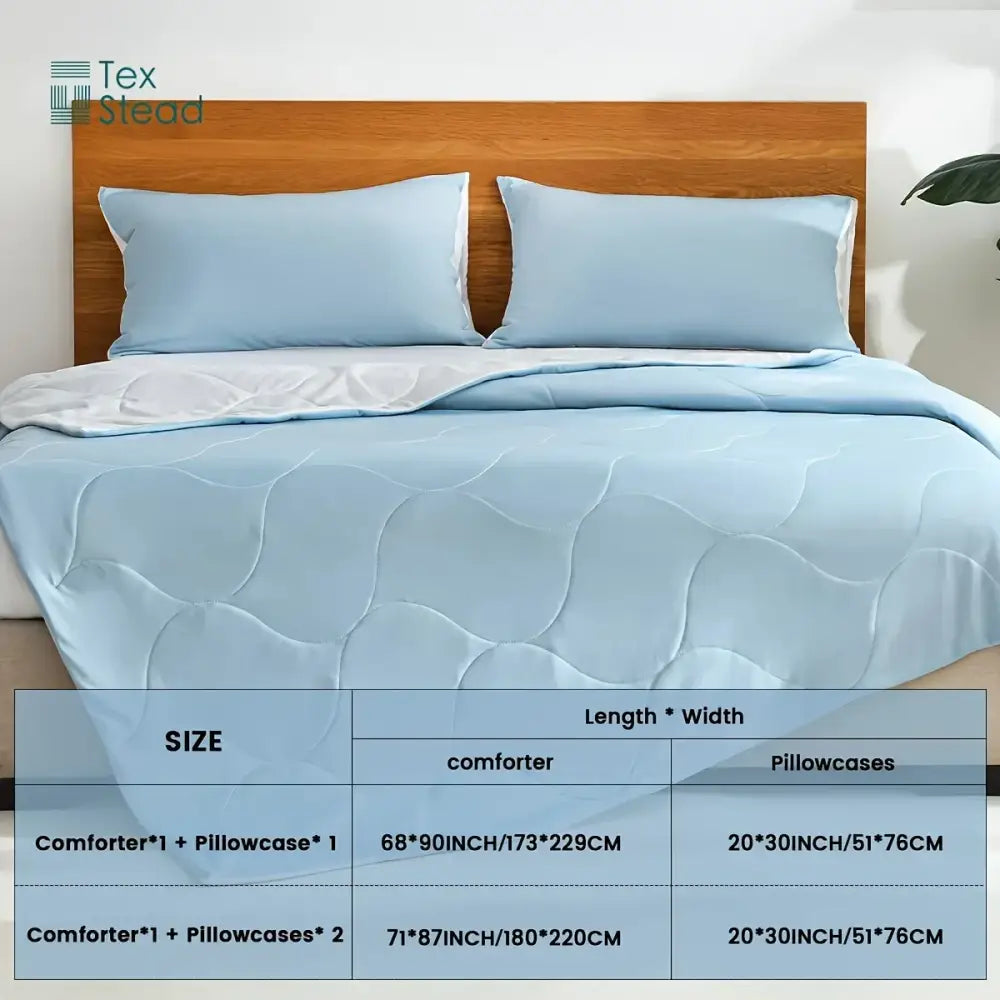 Light blue and white quilted cooling comforter with matching pillowcases featuring soft fabric and wave pattern decorbites cooling comforter
