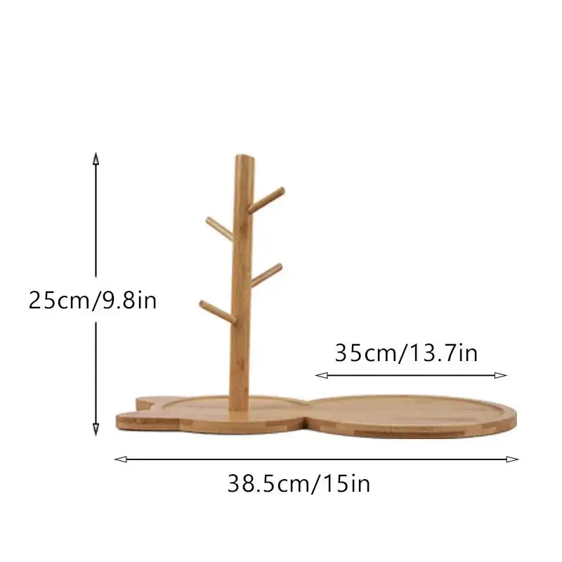 Light brown bamboo tree-shaped mug stand with four arms and flat base as a key rack holder for living room storage