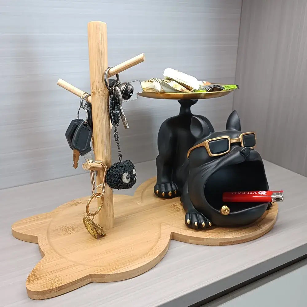 Black french bulldog key rack holder with gold-rimmed sunglasses and metallic accents holding keys and snacks