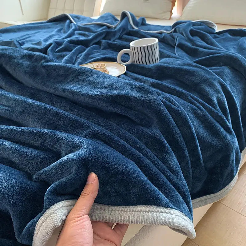 Deep blue plush summer blanket with soft velvety coral velvet texture and light gray ribbed trim by decorbites coral velvet