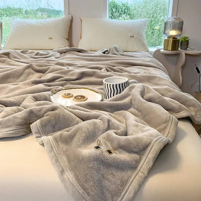 Light gray coral velvet summer blanket with soft plush texture and neatly finished edges by decorbites coral velvet