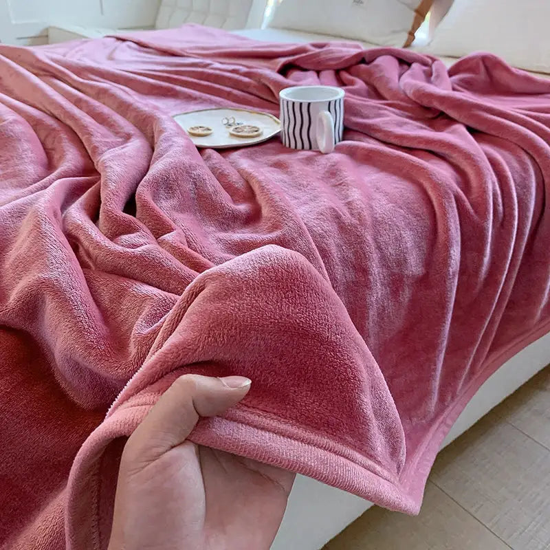 A plush soft pink fleece summer blanket with cozy textured surface from decorbites coral velvet collection