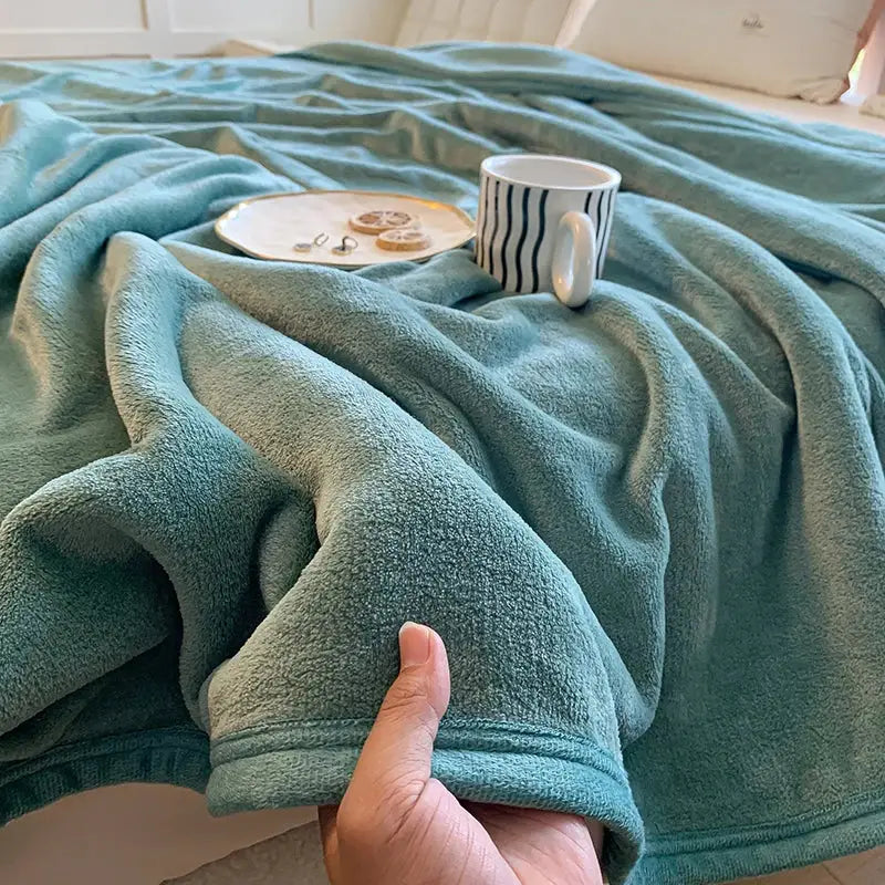 A soft teal coral velvet summer blanket with plush fleece texture and ribbed edge for decorbites coral velvet decor