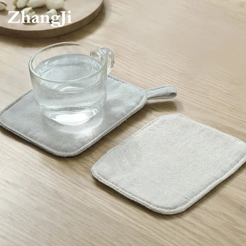 Light gray cotton linen coaster with small loop handle from decorbites cotton linen coaster set for dining room use
