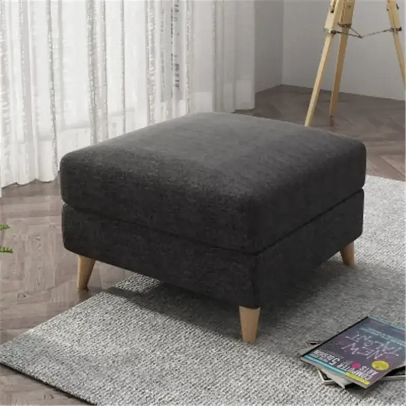 Dark gray upholstered ottoman with light wooden legs featuring decorbites jacquard square stool cover protector
