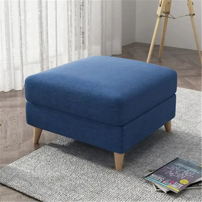 Blue upholstered ottoman with wooden legs featuring light gray jacquard square stool cover decorbites jacquard square