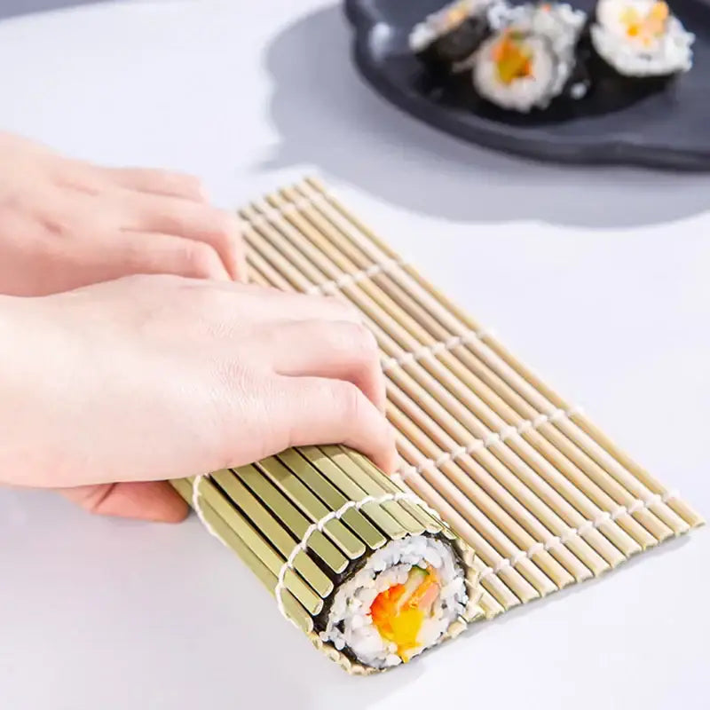 Beige bamboo sushi rolling mat with rolled sushi on it from light green bamboo sushi rolling mat set kitchen diy tool
