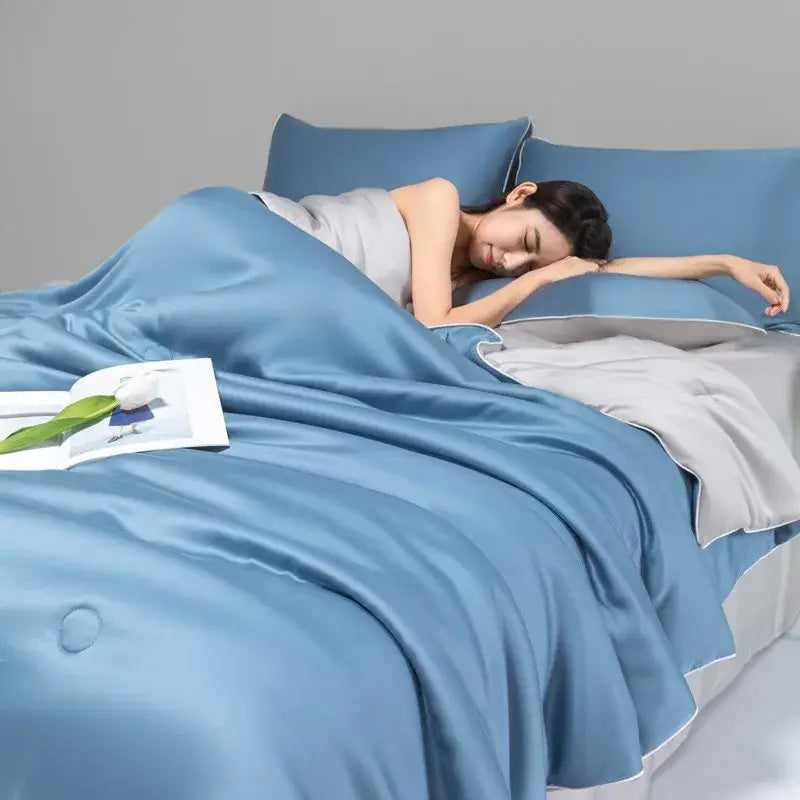 Blue satin duvet cover set with subtle sheen and white piping part of decorbites cool ice silk quilt set bedding