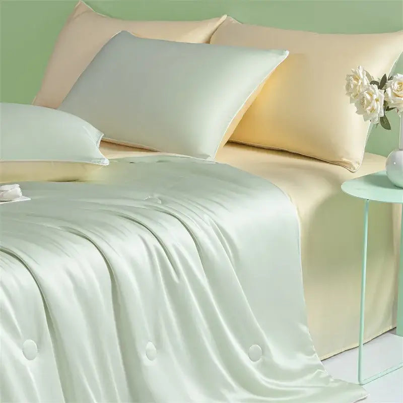 Soft mint green satin duvet cover with subtle sheen and matching pillowcases in decorbites cool ice silk quilt set