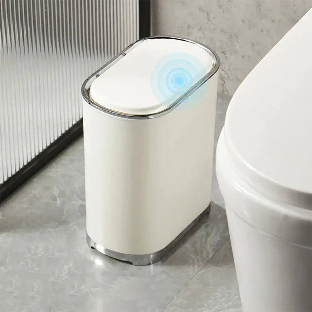 Cream color light luxury bathroom trash can with silver rim sensor lid and base for hands-free use by decorbites light luxury
