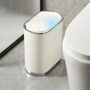 Cream color light luxury bathroom trash can with silver rim sensor lid and base for hands-free use by decorbites light luxury