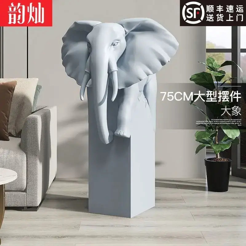 A sleek 75cm tall gray elephant sculpture with detailed features on a matching pedestal decorbites elephant ornaments