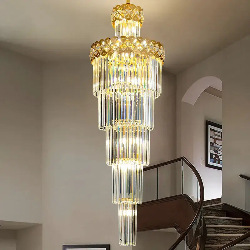 A multi-tiered light luxury crystal chandelier with gold accents and cascading clear glass rods for living room decorbites light luxury