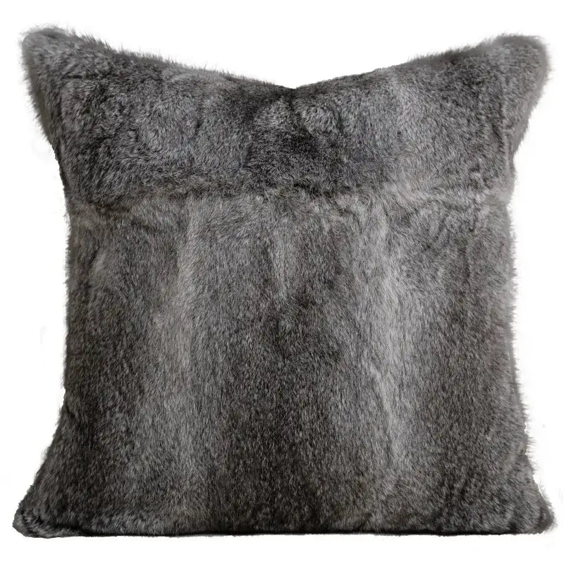 A light luxury designer pillow cover in soft gray faux fur with subtle texture for living room decor