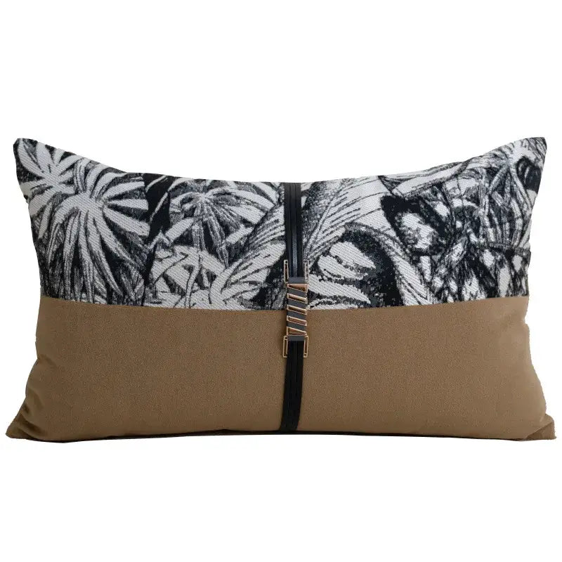 Rectangular light luxury designer pillow cover with black white palm leaf pattern and tan fabric secured by black leather strap