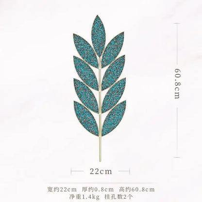 A glittery teal leaf-shaped decorbites light luxury iron pin with a metallic stem for wall decoration