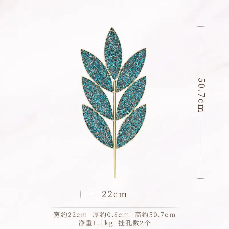 A teal glittery leaf-shaped brooch with gold-tone iron stem, ideal for decorbites light luxury wall decoration