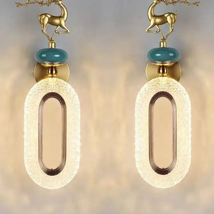 Gold deer-shaped wall lamp set with teal glass orbs and frosted oval diffusers for light luxury modern decorbites decor