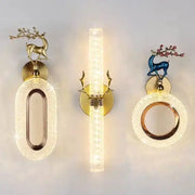 Set of three light luxury modern gold deer wall lamps with decorative branches and warm textured glass panels decorbites wall lamp