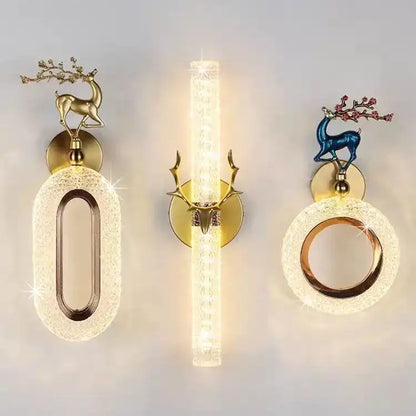Set of three light luxury modern gold deer wall lamps with decorative branches and warm textured glass panels decorbites wall lamp
