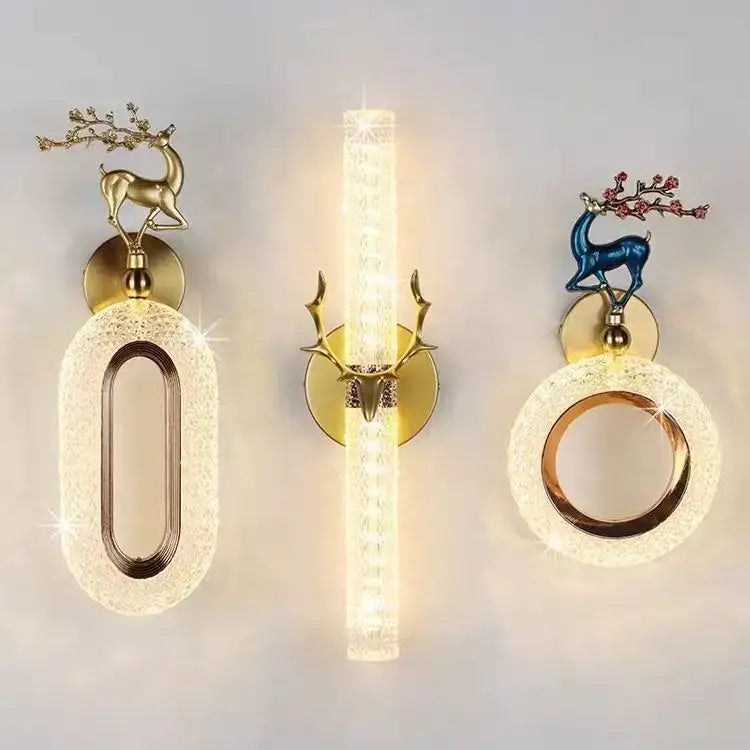 Set of three light luxury modern gold deer wall lamps with decorative branches and warm textured glass panels decorbites wall lamp