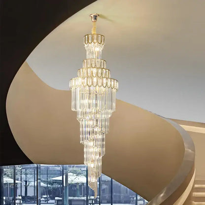 A light luxury rotating crystal chandelier with gold metal frame and cascading clear glass prisms for villa decorbites