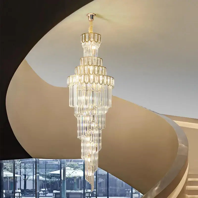 A light luxury rotating crystal chandelier with gold metal frame and cascading clear glass prisms for villa decorbites
