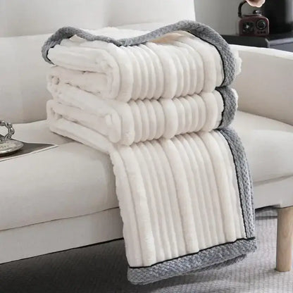 A cream and gray ribbed fleece luxury sofa blanket by decorbites light luxury ideal for elegant living room decor