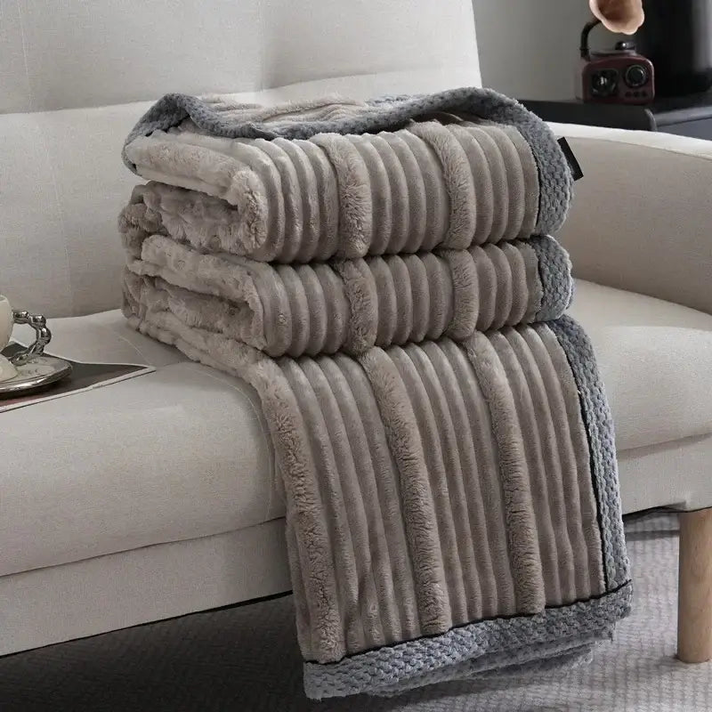 Stacked gray plush throw blanket with ribbed texture and soft fleece material for decorbites light luxury sofa use