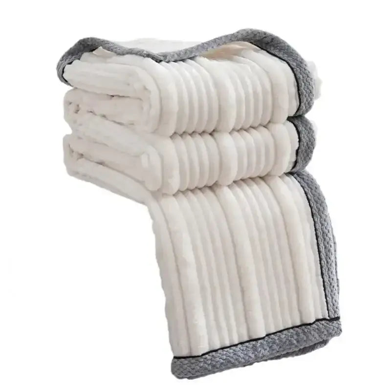 A light luxury sofa blanket in cream fleece with ribbed texture and gray knitted border for decorbites light luxury
