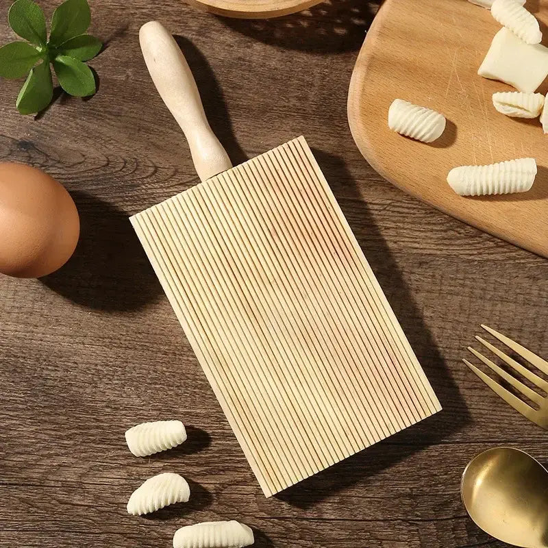 Light wood ridged garganelli board with smooth handle for shaping pasta dough by decorbites garganelli board