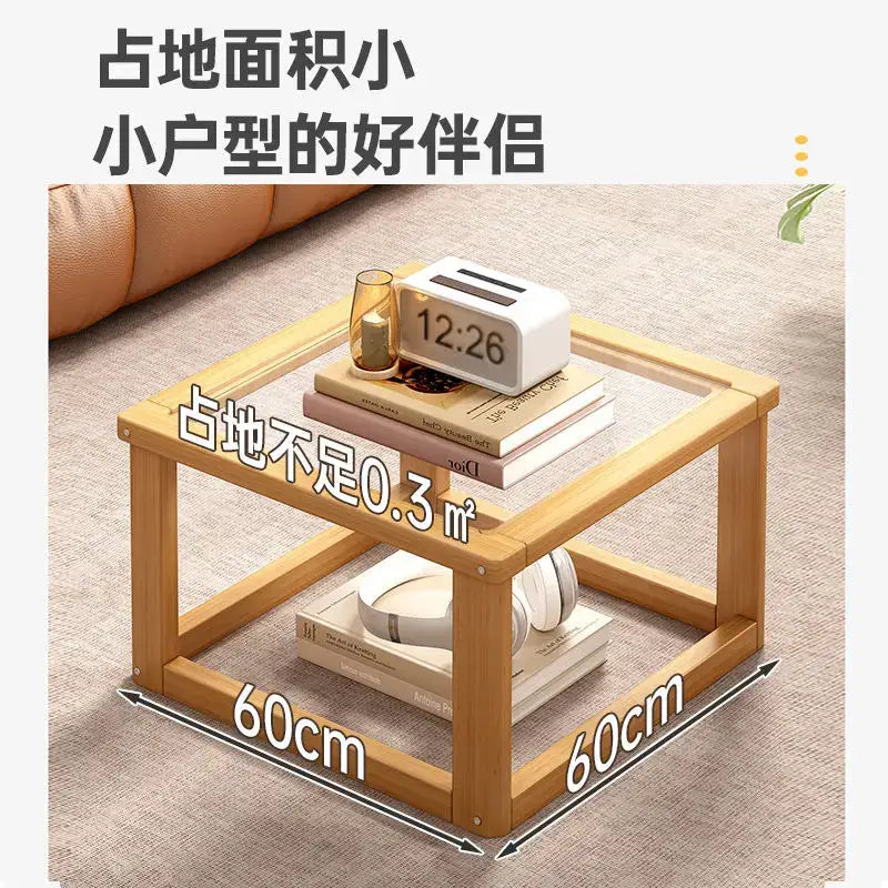 Light brown wooden coffee table set with glass top and lower shelf for living room open shelving use