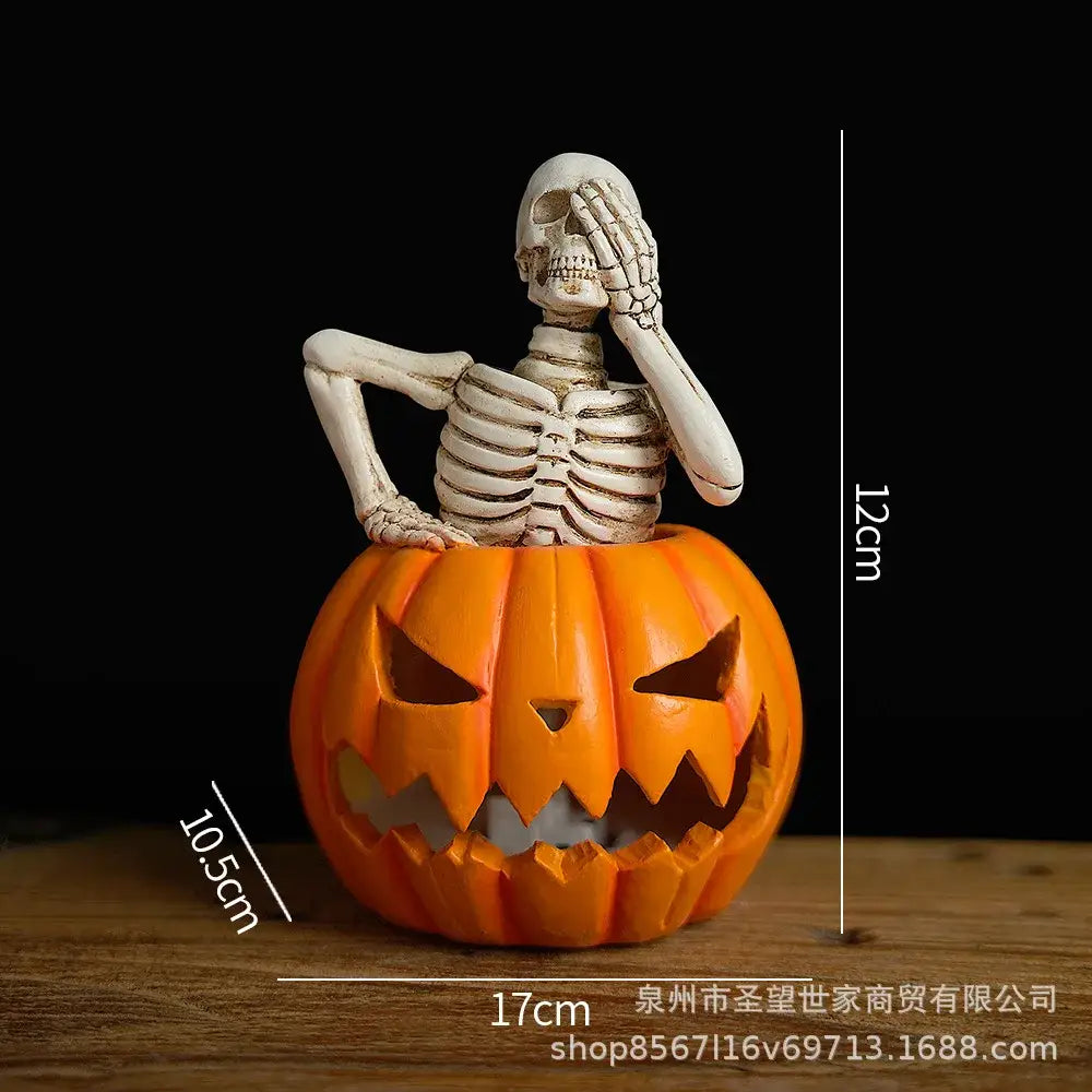 Orange carved skull pumpkin skeleton sculpture with lighted white skeleton figurine for living room decor