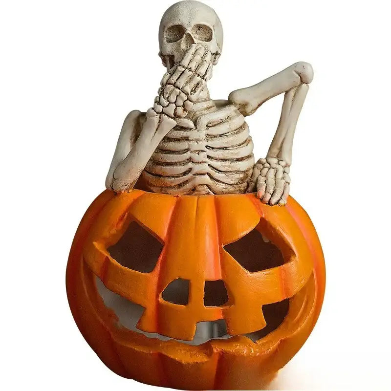 A white plastic skull pumpkin skeleton with detailed bones sits inside a bright orange carved pumpkin for living room decor
