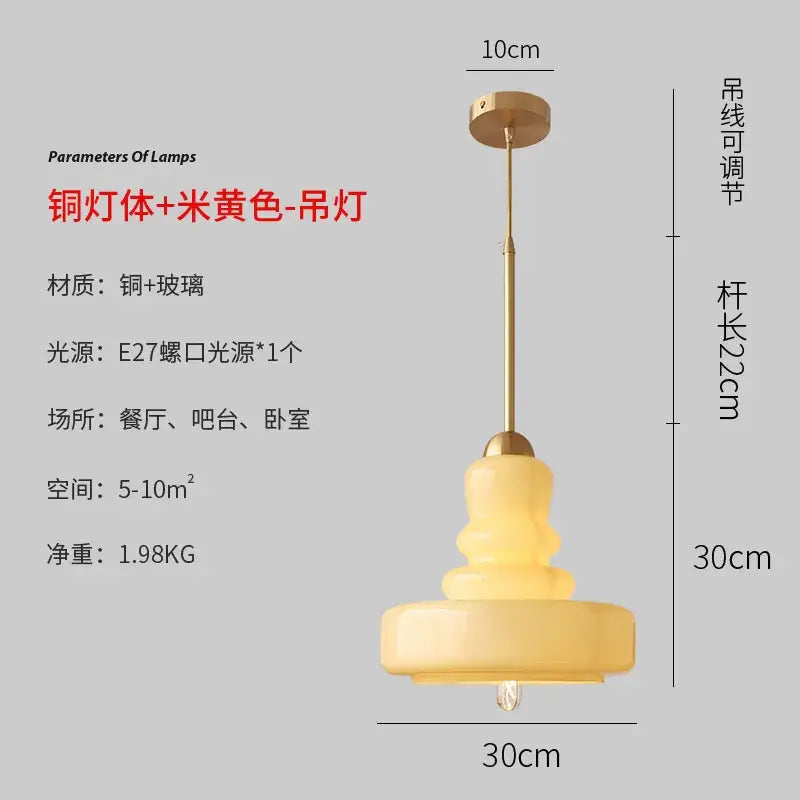 A brass-finished copper and glass pendant light with warm creamy yellow shade for colorful gourd pendant lights