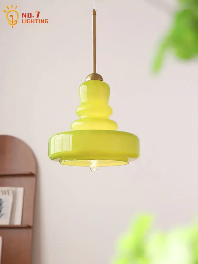 A vibrant lime green glass colorful gourd pendant light with brass hardware for kitchen and dining room pendant lights