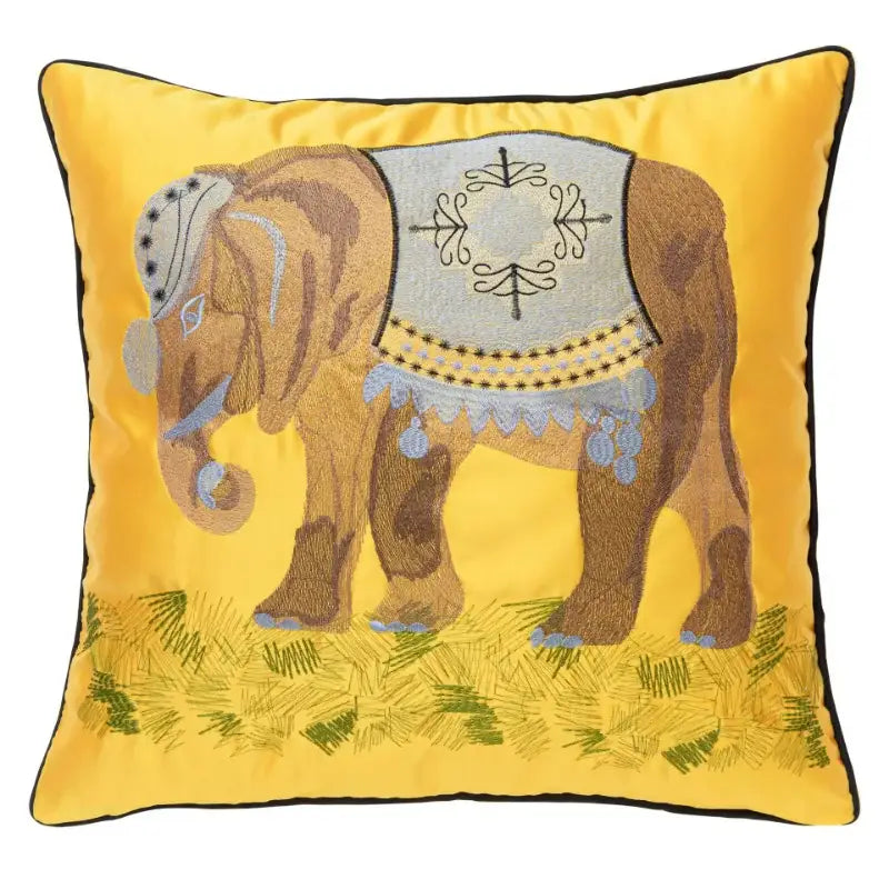 Vibrant yellow cushion cover with decorbites elephant embroidery featuring a gray saddle and blue tassels for sofa decor