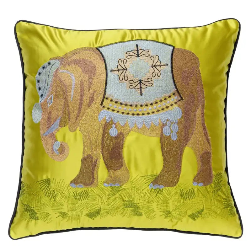 Vibrant yellow satin cushion cover with decorbites elephant embroidery featuring brown elephant and blue harness fringe