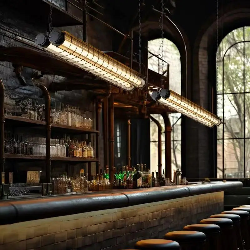 Industrial-style linear chandelier glass pendant lamp with warm glowing illumination and metal mesh cages