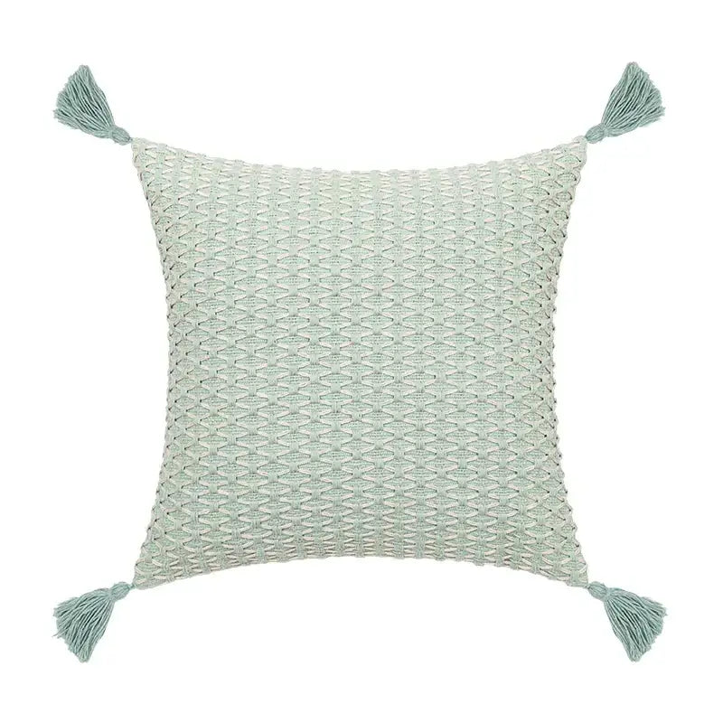 Square light mint green cushion cover with textured woven pattern and tassels featuring decorbites linen embroidery leaves
