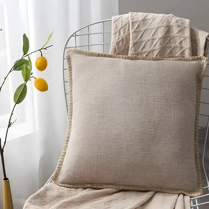 Beige linen fringe cushion cover with frayed edge detailing for neutral tones living room decorbites linen fringe pillow